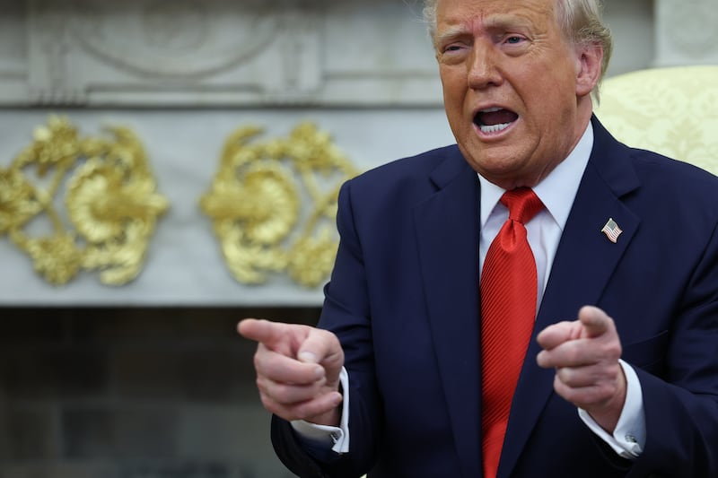 President Donald Trump answers questions as he meets with El Salvador's President Nayib Bukele  in the White House April 14, 2025 in Washington, D.C.