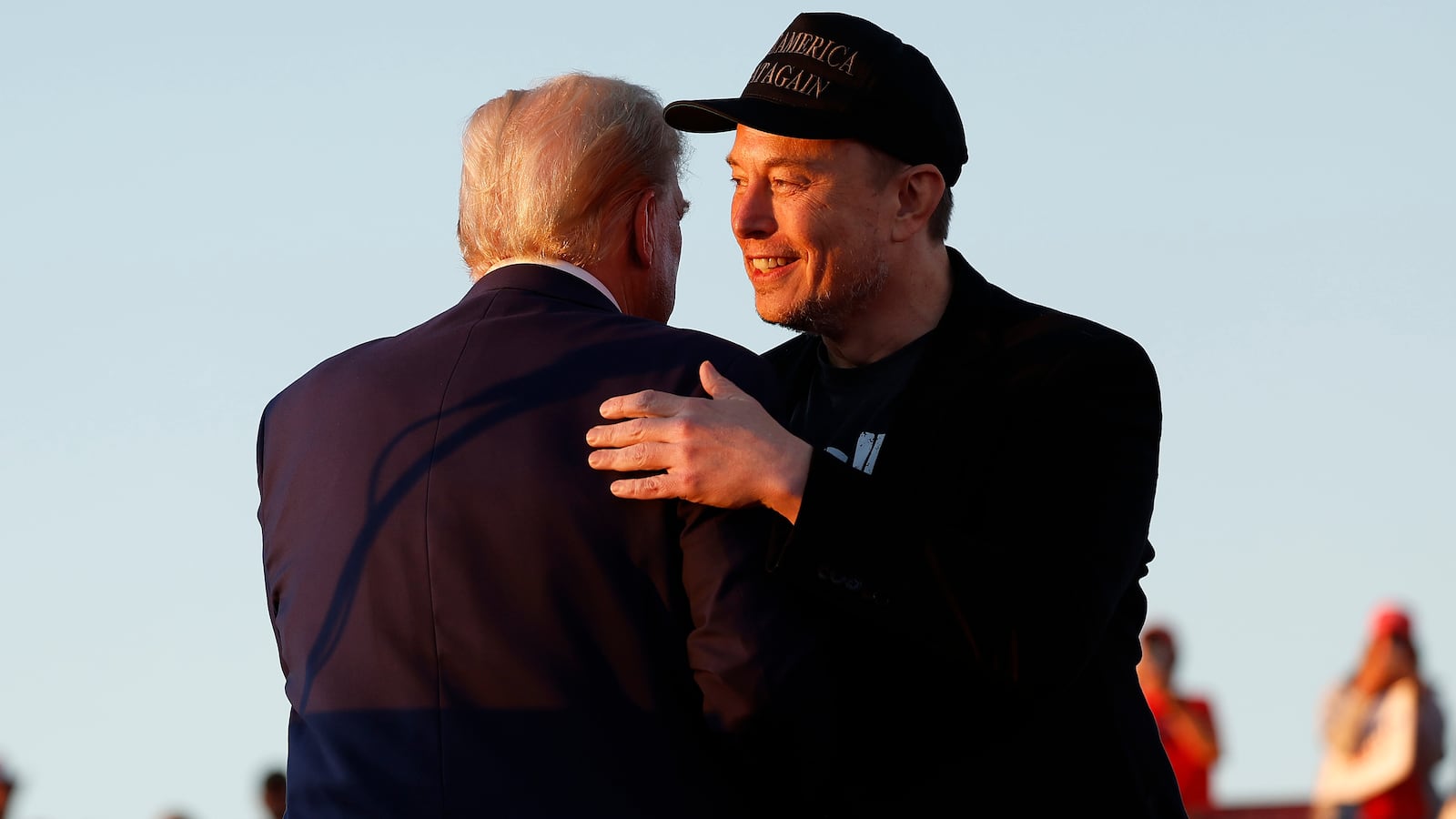 Elon Musk embraces Donald Trump during a campaign rally on October 05, 2024 in Butler, Pennsylvania.